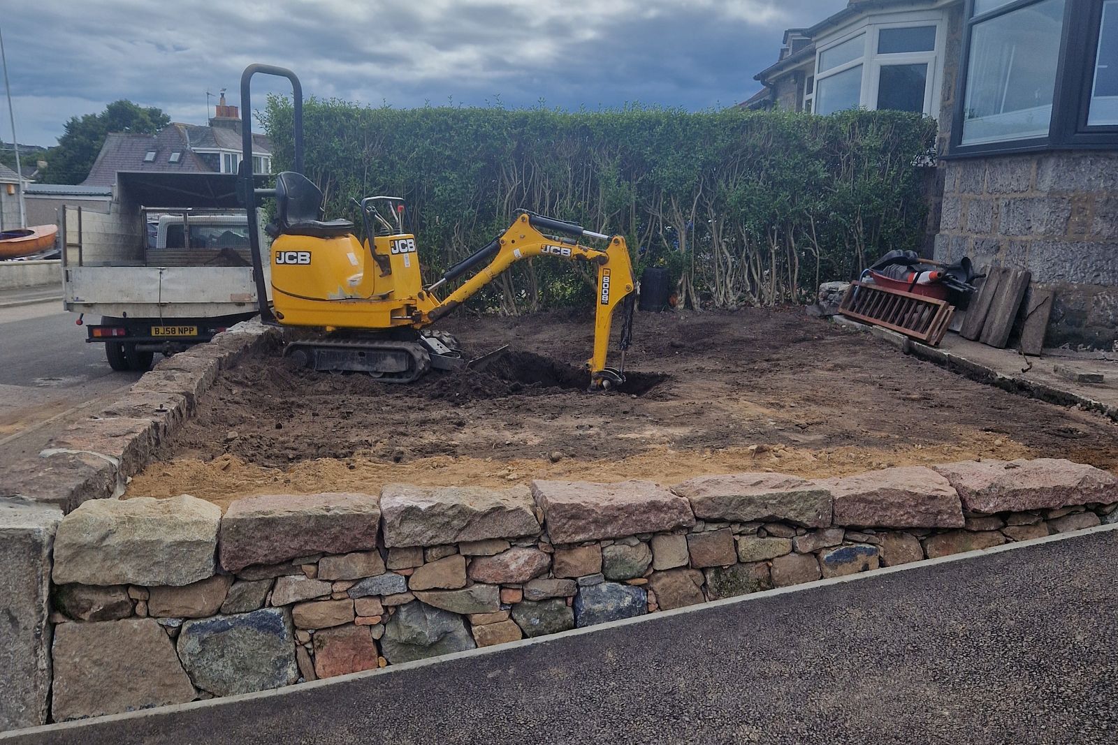 Granite retaining wall under construction