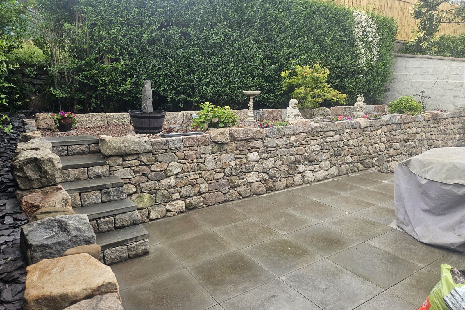 Finished dry stone wall, steps and paved terrace